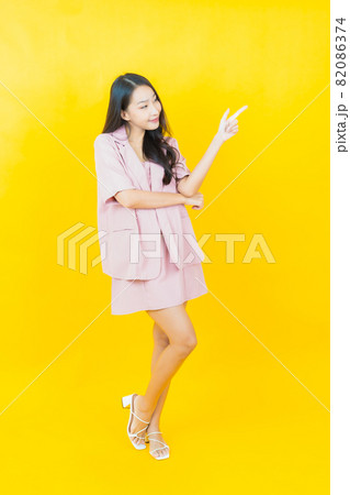 Portrait beautiful young asian woman smile with action Portrait beautiful young asian woman smile with action 82086374