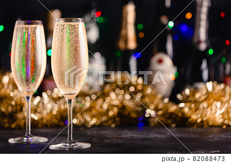 Champagne glasses on a dark background. Champagne glasses on a dark background. 82088473