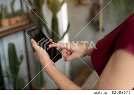 woman using smart phone for mobile payments online shopping channel. woman using smart phone for mobile payments online shopping channel. 82088672
