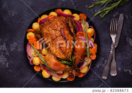 Whole baked chicken with vegetables. Whole baked chicken with vegetables. 82088673