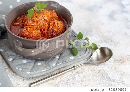 Meat balls on a light background with sage and parsley leaves. Homemade lunch. 82089891