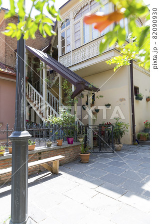Staircase to the old building in the city of Tbilisi, Georgia. The architecture of the old city. Stone stairs. Wooden colored stairs. Staircase to the old building in the city of Tbilisi, Georgia. The architecture of the old city. Stone stairs. Wooden colored stairs. 82090930