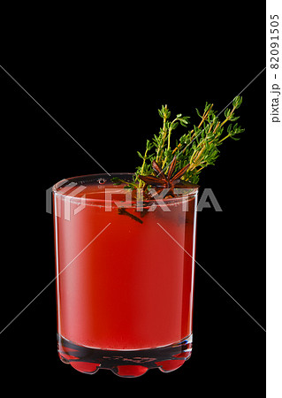 Hot cranberry winter drink with thyme, cloves and anise Hot cranberry winter drink with thyme, cloves and anise 82091505
