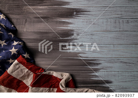 Close up of waving national usa american flag on wooden background. Close up of waving national usa american flag on wooden background. 82093937