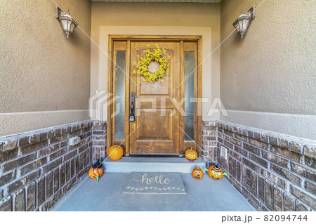 Halloween decorations at the door of a house Halloween decorations at the door of a house 82094744