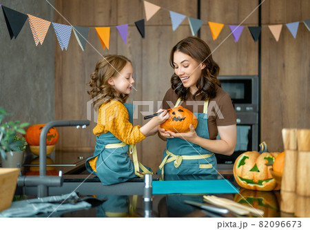 family preparing for Halloween 82096673