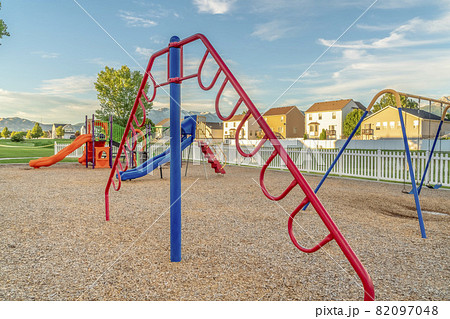 Fun playground for children with colorful slides swings and climbing bars 82097048