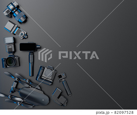 Top view of designer workspace and photography gear on black table background Top view of designer workspace and photography gear on black table background 82097528