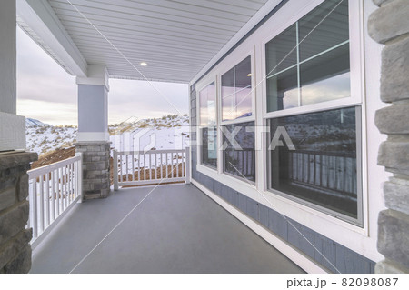 Long covered patio with large glass windows Long covered patio with large glass windows 82098087