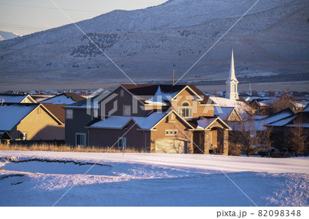 View of American town with a chapel in winter View of American town with a chapel in winter 82098348