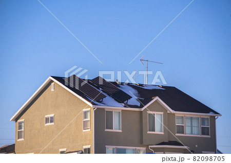 Two angled solar panels on a house roof 82098705