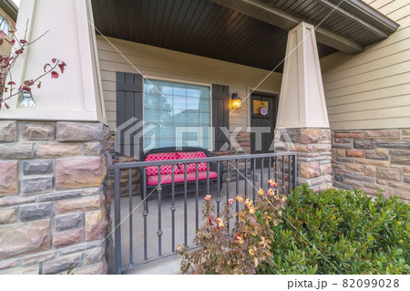 Front veranda with colourful red bench day light Front veranda with colourful red bench day light 82099028