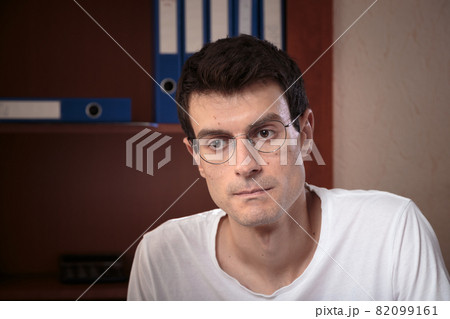 Portrait of a concentrated young man. Portrait of a concentrated young man. 82099161