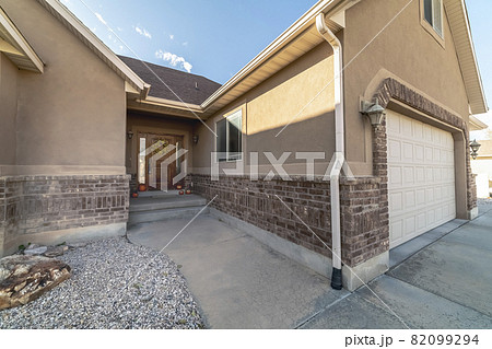 Entrance door and garage of an urban house 82099294
