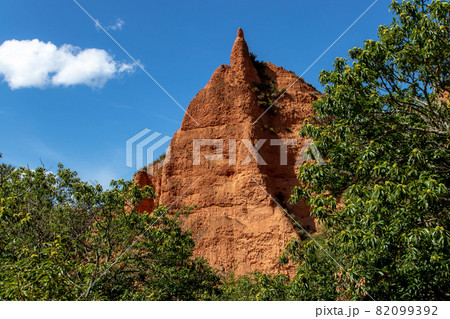 Bright red rock and chestnut trees at the Las Medulas World Heritage Site. 82099392