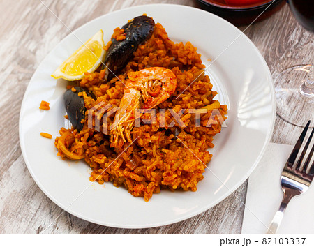 Paella on white plate Paella on white plate 82103337