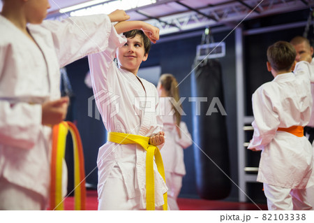 Two boys working in pair, mastering new karate moves 82103338