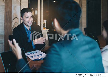 During a job interview, a man in a suit and gives a presentation about himself 82111488