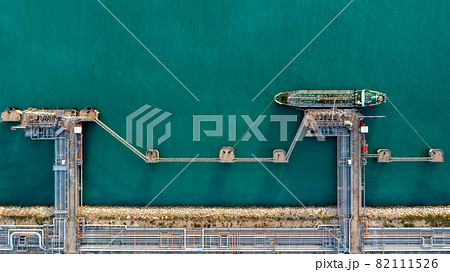 Aerial view industrial crude oil and fuel tanker ship at deep ocean sea port, Tanker ship vessel at terminal port, Business import export oil and gas petrochemical by tanker ship transportation oil. 82111526