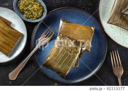 Tamal, traditional dish of the cuisine of Mexico, various stuffings Tamal, traditional dish of the cuisine of Mexico, various stuffings 82113177