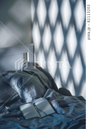Open diary to write on the bed with blue textiles in the moonlight. Evening rituals for mental health. 82113203