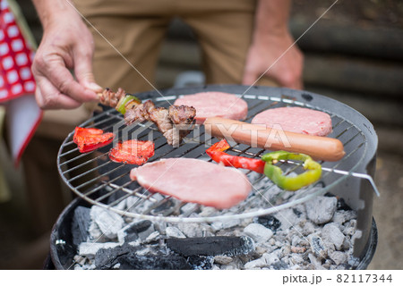 Close-up of cooking food on BBQ Close-up of cooking food on BBQ 82117344