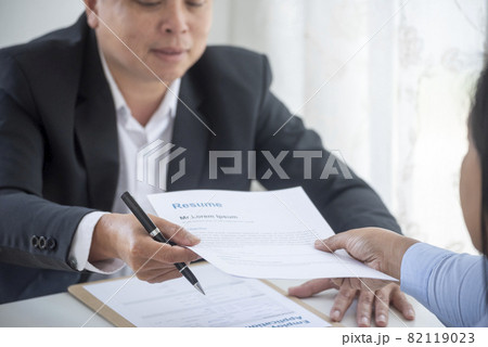 Businessman job interview by human resource HR officer interviwing, talk new employee shaking hands in office with smiling face. HR Manager interview check resume, face to face. Job Interview Concept Businessman job interview by human resource HR officer interviwing, talk new employee shaking hands in office with smiling face. HR Manager interview check resume, face to face. Job Interview Concept 82119023