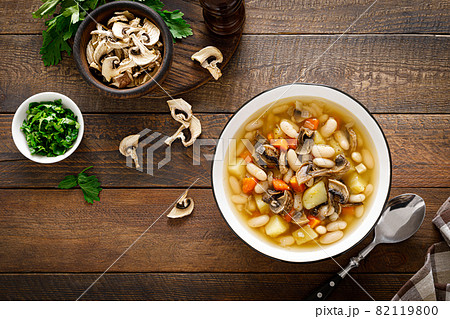 Mushroom soup with kidney bean, potato and carrot. Top view, copy space Mushroom soup with kidney bean, potato and carrot. Top view, copy space 82119800