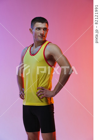 Cropped portrait of young male professional athlete isolated over gradient studio background 82121991