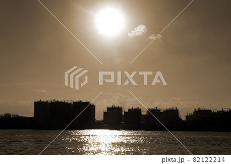 Silhouette, Back view of oil storage tanks in the export port, the oil business that exports by ships. 82122214