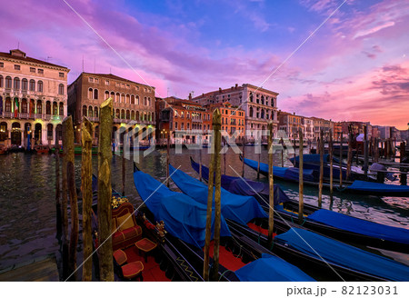 Sunset view of Grand Canal, Venice, Italy. UNESCO heritage city famous for its waterways and gondolas, beautiful sunset sky and evening lights 82123031