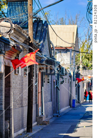 National flags of China, decorating narrow hutong street in central Beijing 82124308