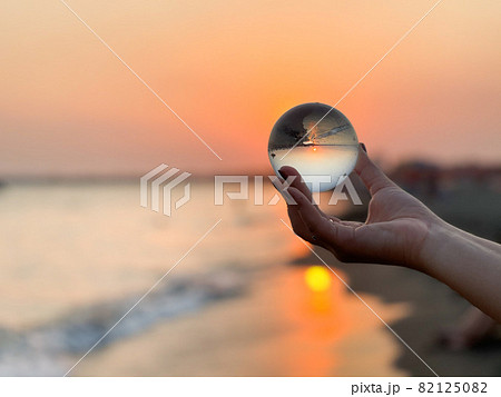 Beautiful scenic view through lens of crystal ball at summer sunset. Beautiful scenic view through lens of crystal ball at summer sunset. 82125082