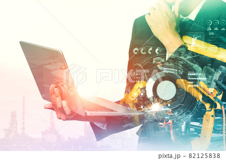 Mechanized industry robot arm and factory worker double exposure Mechanized industry robot arm and factory worker double exposure 82125838