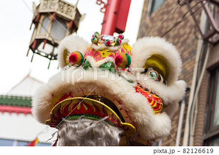 Traditional Dragon dance during Lunar New Year celebration in Chinatown in Kobe, Japan Traditional Dragon dance during Lunar New Year celebration in Chinatown in Kobe, Japan 82126619