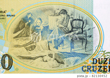 Flag being embroidered by a family from Brazilian money 82130452