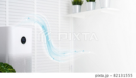 air purifier a living room, air cleaner removing fine dust in house. protect PM 2.5 dust and air pollution concept 82131555
