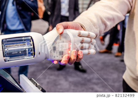 Human hand and robot's as a symbol of connection between people and artificial intelligence technology Human hand and robot's as a symbol of connection between people and artificial intelligence technology 82132499