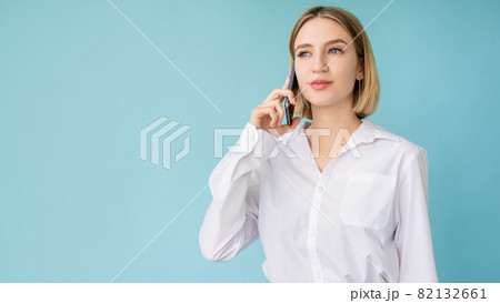 Business call. Confident woman. Digital technology. Elegant happy lady talking mobile phone isolated blue copy space. 82132661
