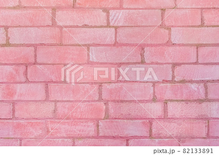 Pink color paint on old brick wall texture background Pink color paint on old brick wall texture background 82133891
