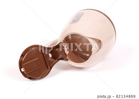 Electric kettle, isolated on white. Stylish modern beige and brown. 82134869