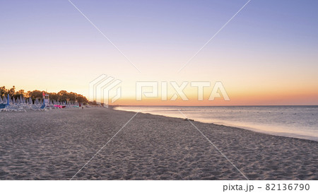 Panorama of adriatic sea and beach with umbrella at sunrise 82136790
