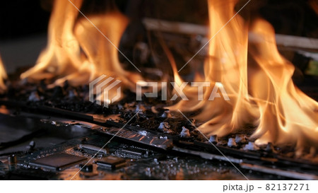 Burning laptop computer electronics closeup 82137271