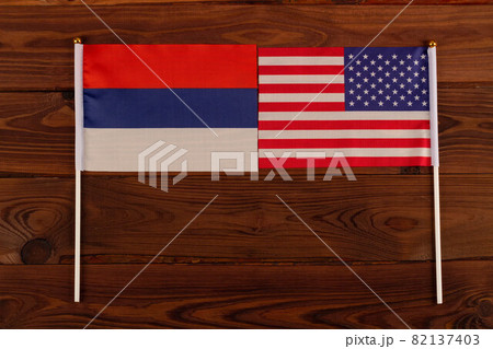 The US and the Russian flag face each other. Kiss of friendship. USA vs Russia. Meeting between the presidents of the United States and Russia. Tensions in relations between the countries are growing The US and the Russian flag face each other. Kiss of friendship. USA vs Russia. Meeting between the presidents of the United States and Russia. Tensions in relations between the countries are growing 82137403