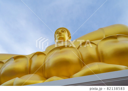 The Giant Golden Buddha in Wat Paknam Phasi Charoen Temple in Phasi Charoen district at noon, Bangkok urban city town, Thailand. Tourist attraction landmark. 82138583
