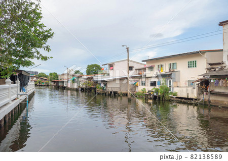 Residential local houses with Phasi Charoen canal or river, nature trees, Wutthakat district, Bangkok City, Thailand in urban city town in Asia, buildings. 82138589