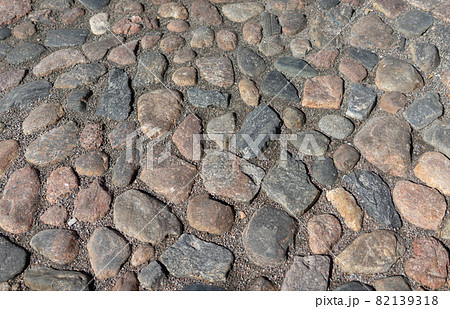 Old cobblestone pavement in the ancient European city Old cobblestone pavement in the ancient European city 82139318