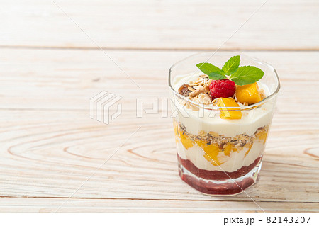 homemade mango and raspberry with yogurt and granola homemade mango and raspberry with yogurt and granola 82143207