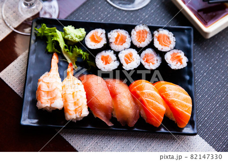 Various sushi served on black plate. Japanese food Various sushi served on black plate. Japanese food 82147330