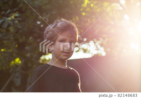 Little boy in garden Little boy in garden 82148683